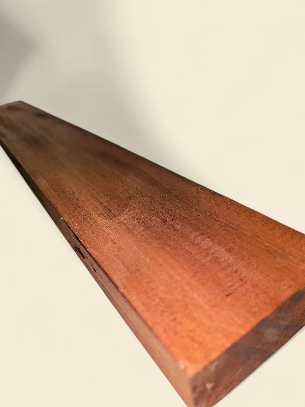 Mahogany guitar neck blank, fourth view, on linen backdrop