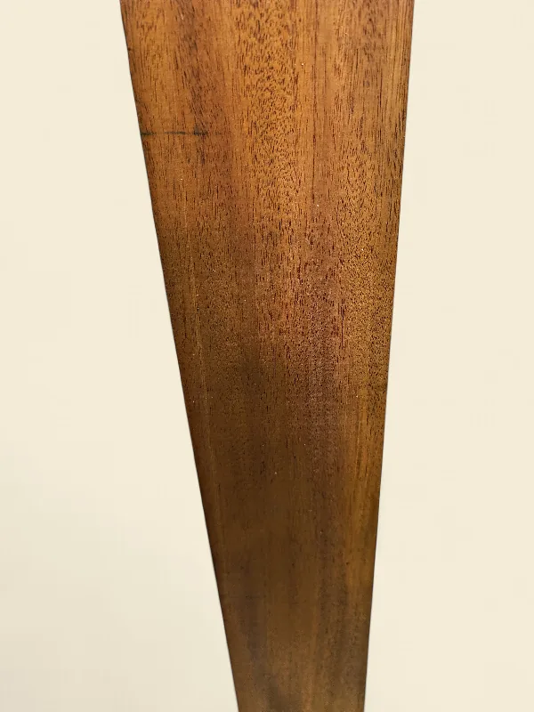 Mahogany guitar neck blank on linen backdrop