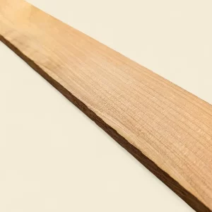 Macrocarpa Pine sawn board on linen backdrop