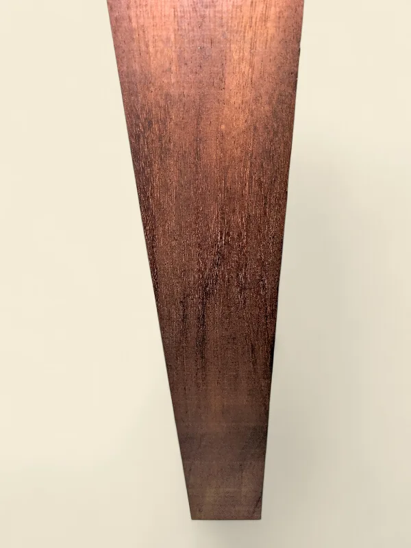 Old-growth Khaya Mahogany guitar neck blank on linen backdrop
