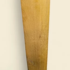 Saffron Heart (Halfordia kendack) sawn timber on linen backdrop, golden-yellow heartwood