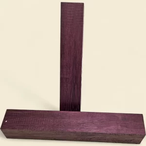 Purpleheart spindle blank — dressed timber on linen background