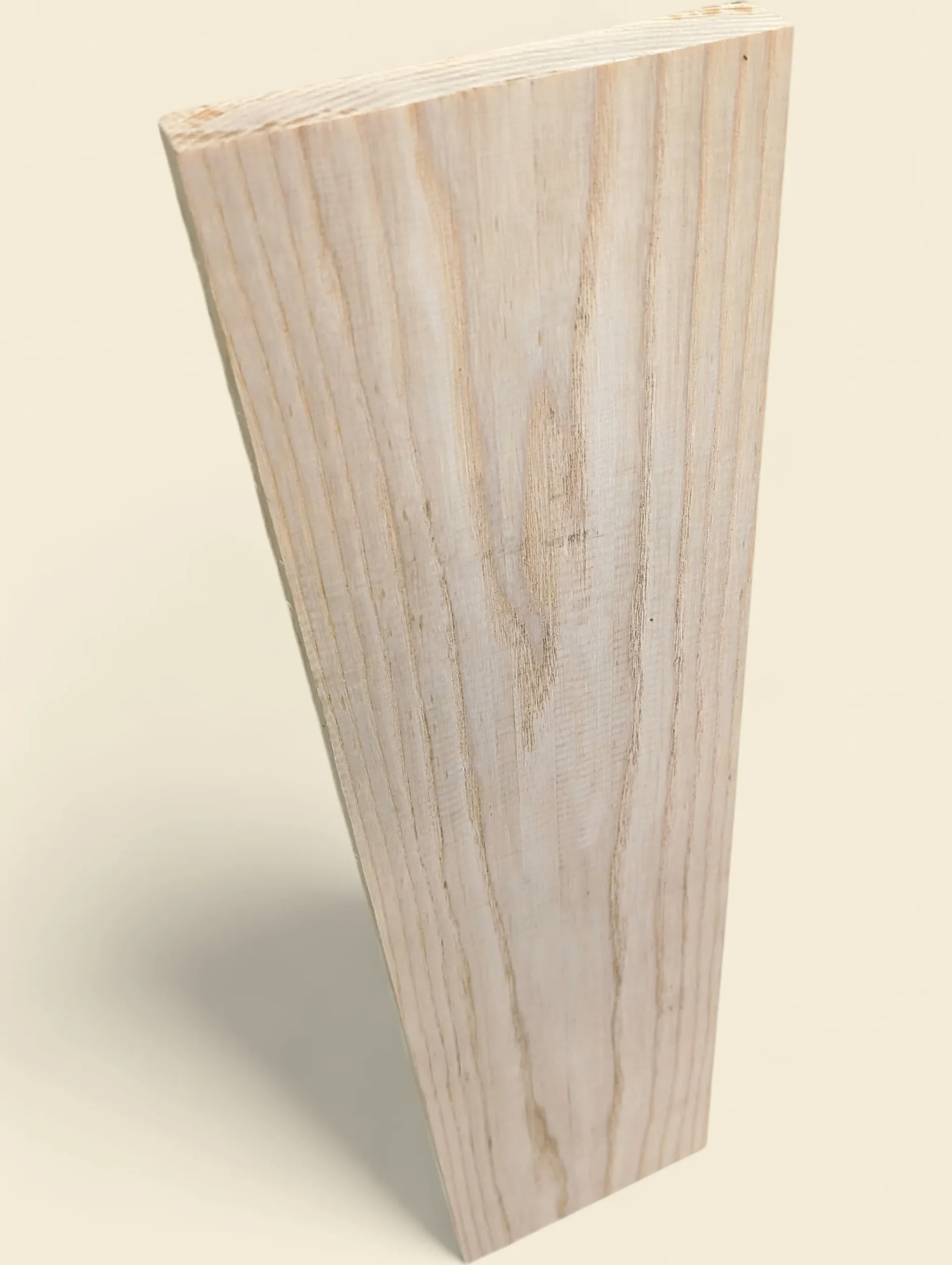 American Ash dressed face, angled view showing grain, on linen background