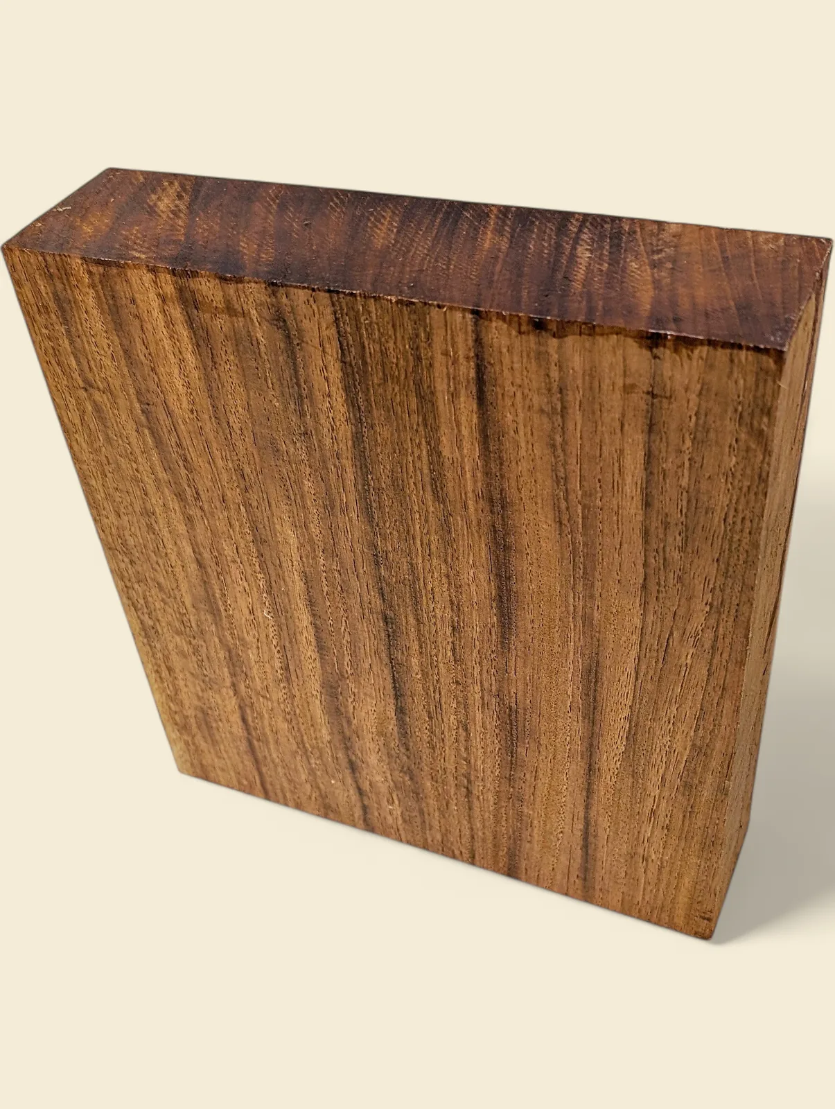 New Guinea Rosewood wide turning blank, angled view on linen background