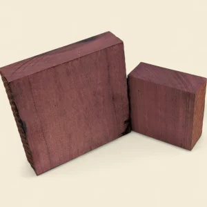 Purple Heart square timber blanks in two sizes on linen background