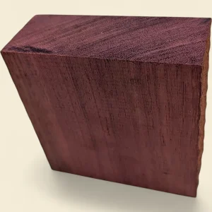 Purple Heart turning blank, 125 x 125 x 50mm square faceplate stock on linen background