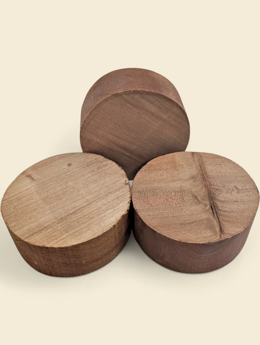 Rose Alder bowl blank, 120mm diameter - group of blanks showing colour and figure variation, on linen backdrop