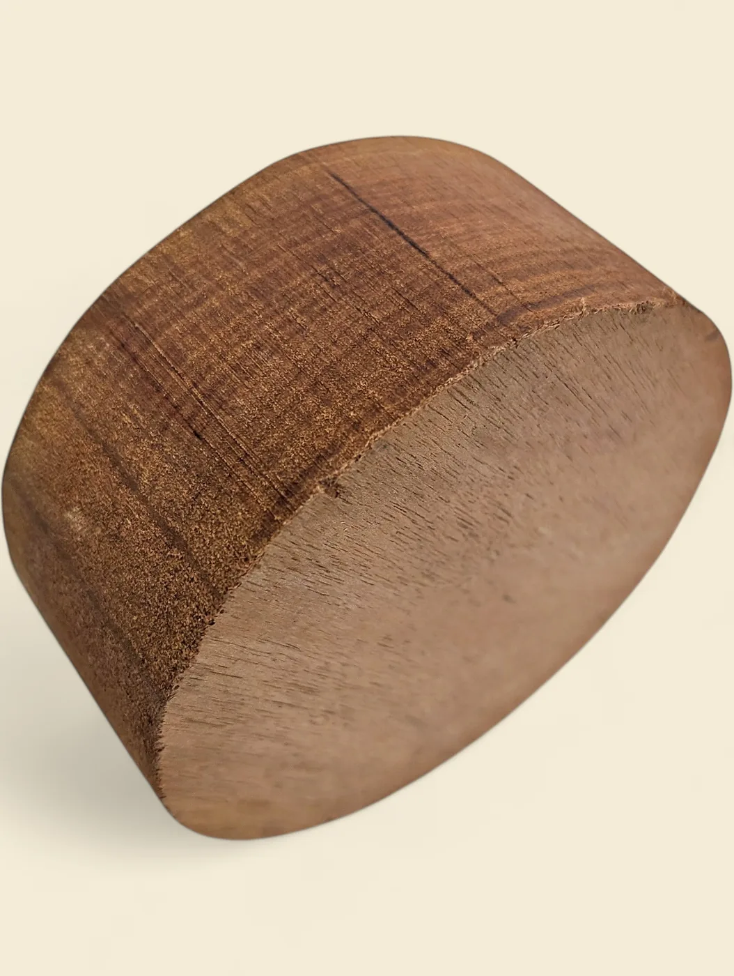 Rose Butternut bowl blank, 115mm diameter - face detail showing grain and figure, on linen backdrop