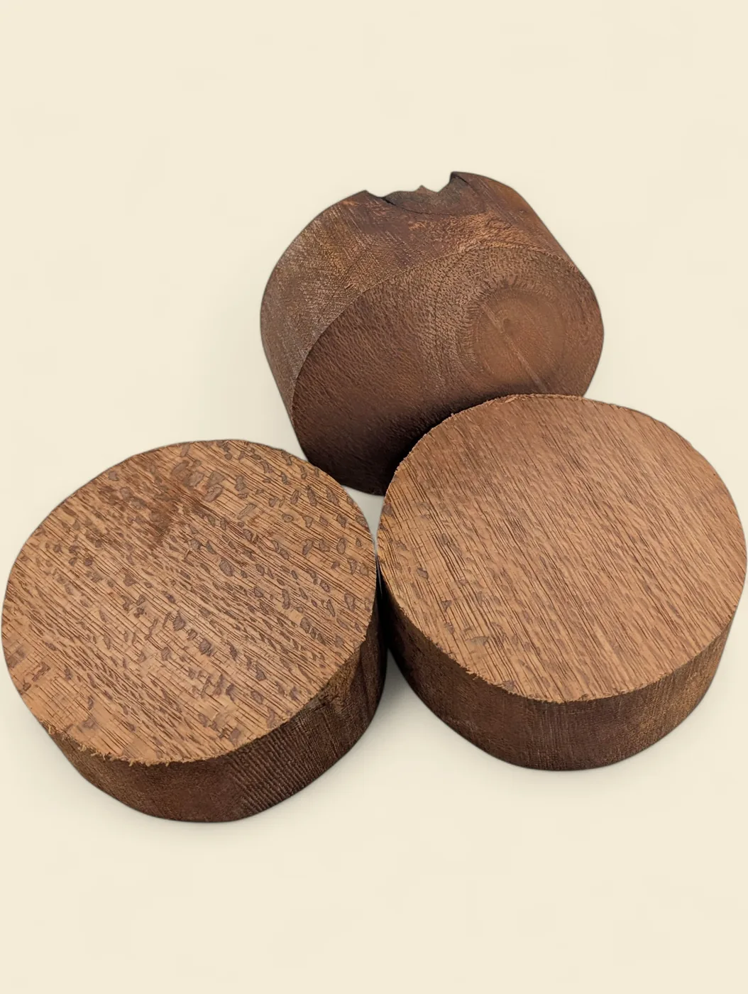 Satin Oak bowl blank, 115mm diameter - group of blanks showing colour and figure variation, on linen backdrop