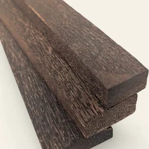 Black palm timber stock showing black-on-tan streaked figure