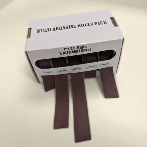 Dispenser box of five 25mm abrasive rolls, 150 to 600 grit, strips pulled out the front