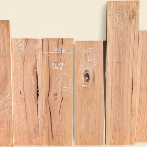 Six dressed Blackbutt boards, 285mm wide and 42mm thick, standing side by side