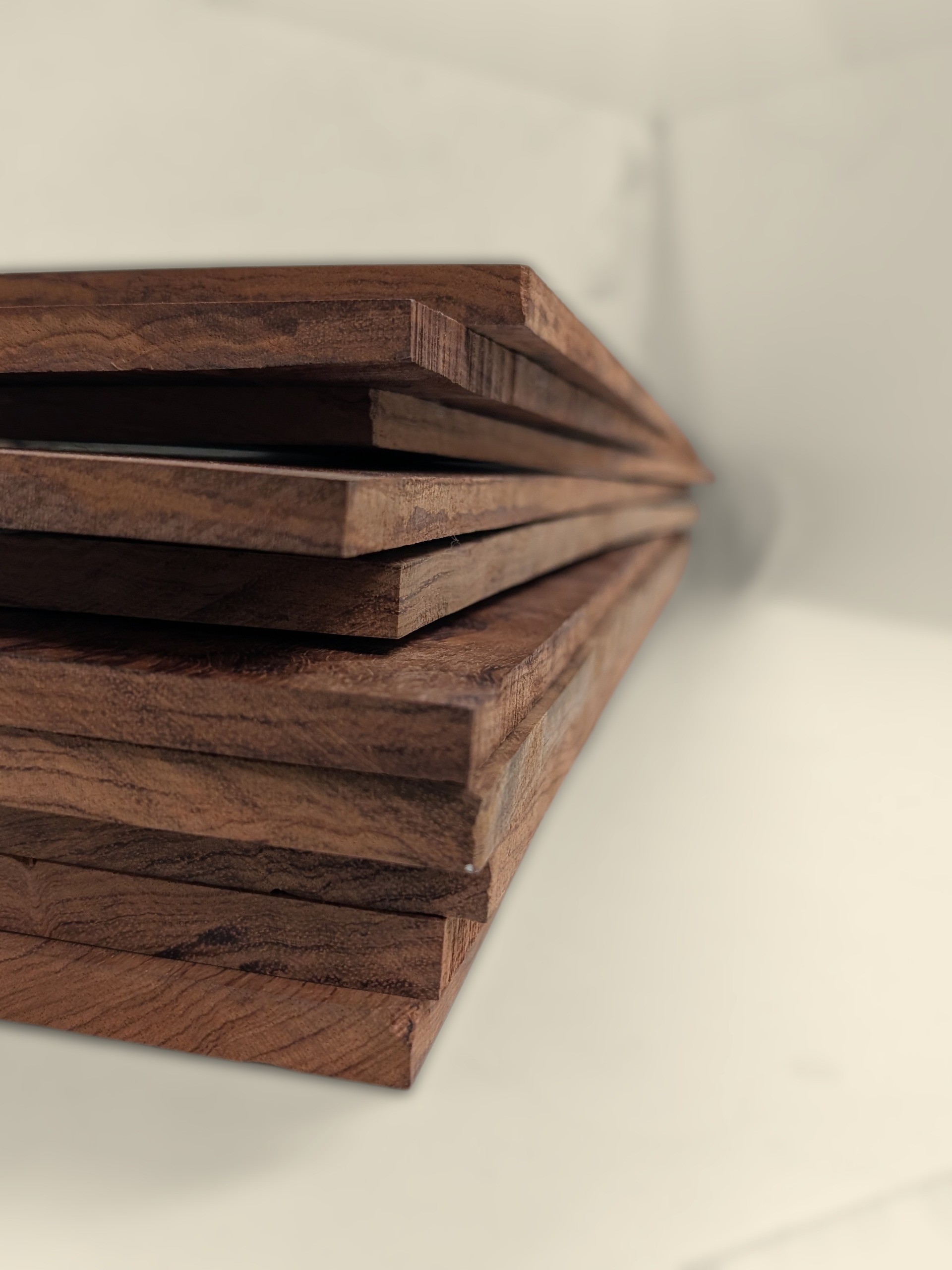 Stack of bubinga boxmaking boards showing movement after milling