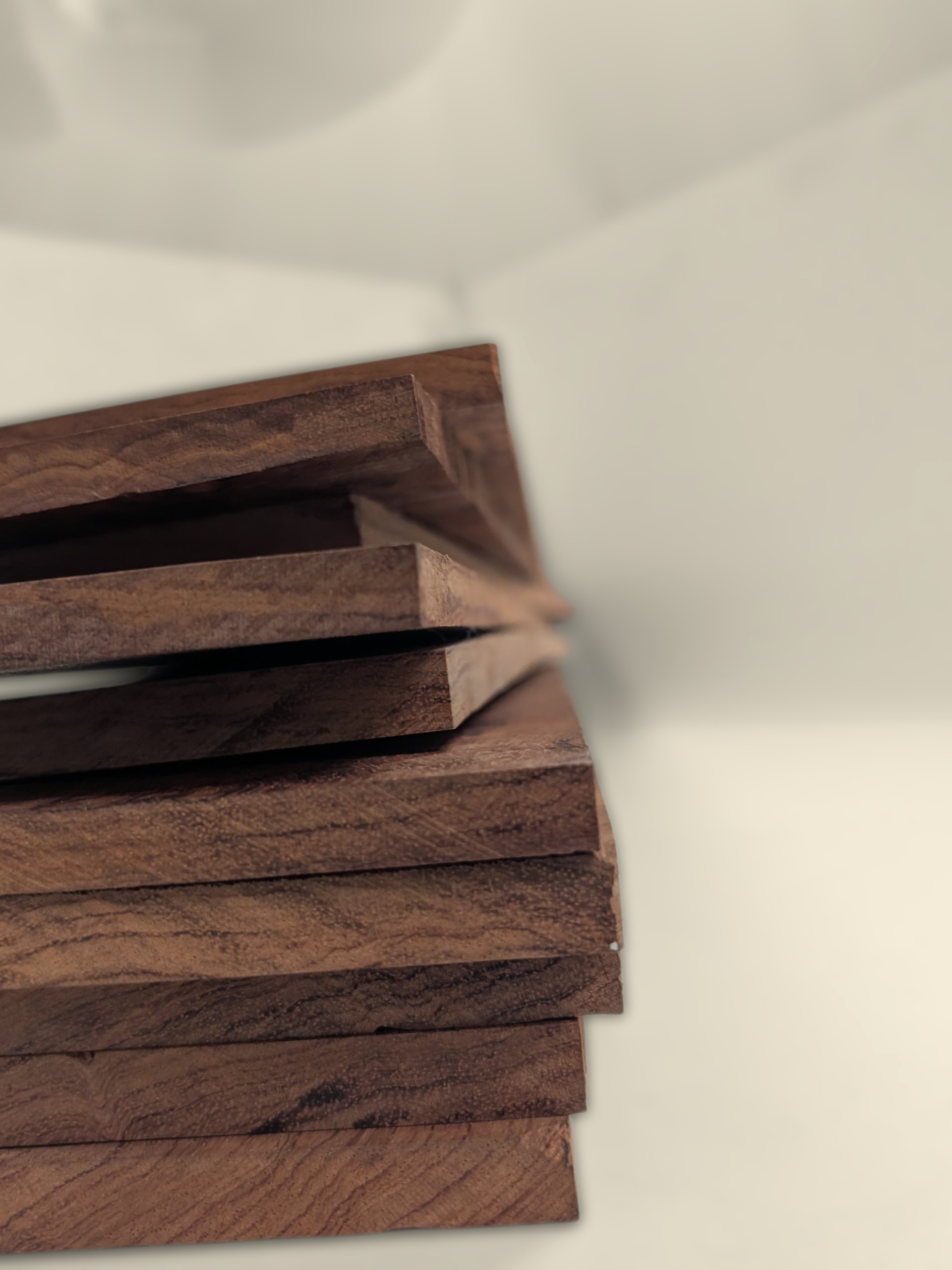 Stack of bubinga boxmaking boards showing movement after milling