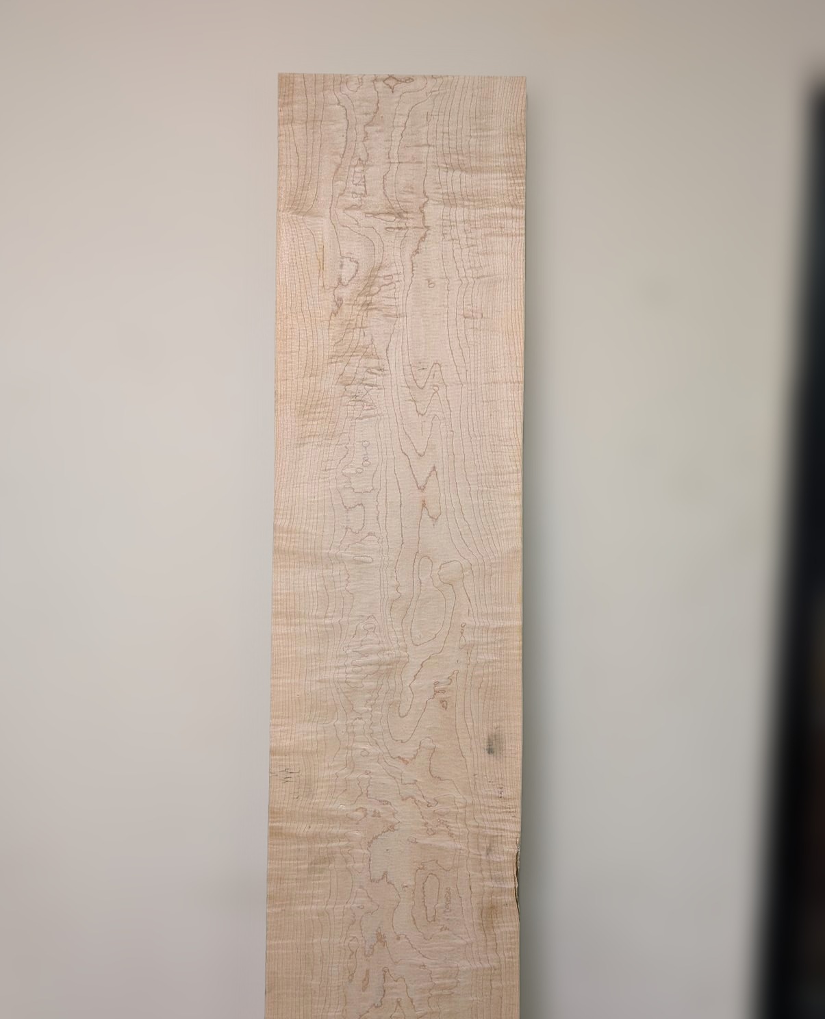 Curly Rock Maple board 1, the whole board standing against a wall