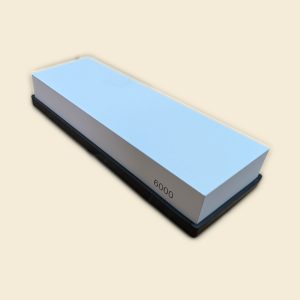 6000 grit waterstone on black rubber base